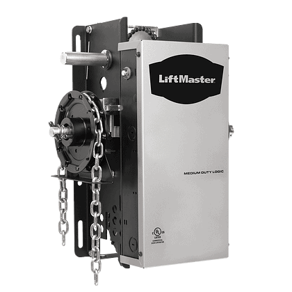 Image of a LiftMaster garage door opener. The unit is rectangular with a metallic finish and features a chain mechanism on the side. The logo reads "LiftMaster" with the text "Medium Duty Logic" beneath it, showcasing essential garage door accessories for seamless operation.